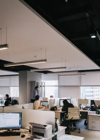 Open-plan software office with developers at their desks